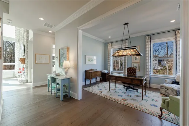 a open kitchen with granite countertop a sink dining table and chairs