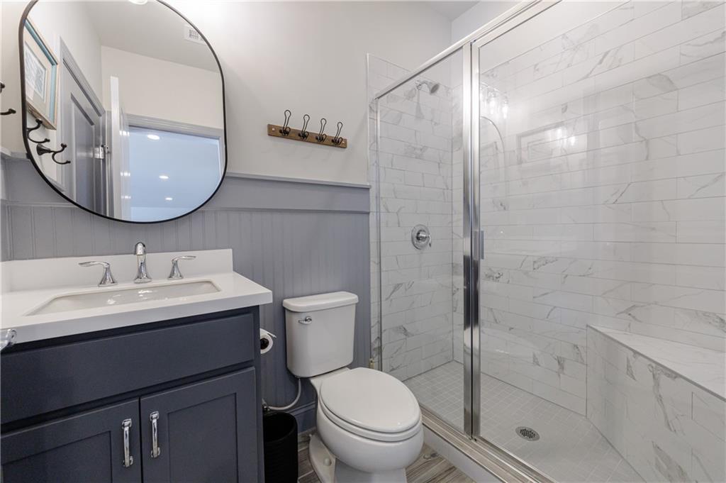 3085 Gray Hawk Lane Roswell, GA 30076 - Photo 74 of 99 a bathroom with a sink toilet and shower