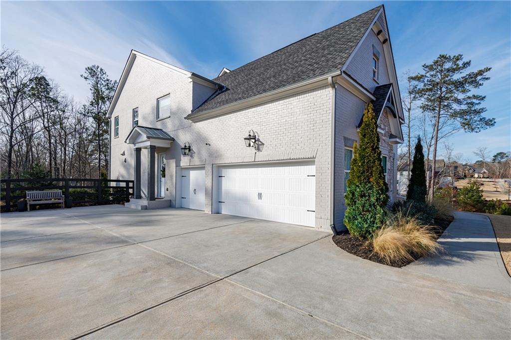 3085 Gray Hawk Lane Roswell, GA 30076 - Photo 86 of 99 a view of a house with a yard and potted plants