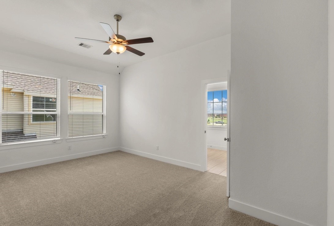5234 Capricorn Way Manvel, TX 77578 - Photo 17 of 25 a view of a livingroom with a ceiling fan and window