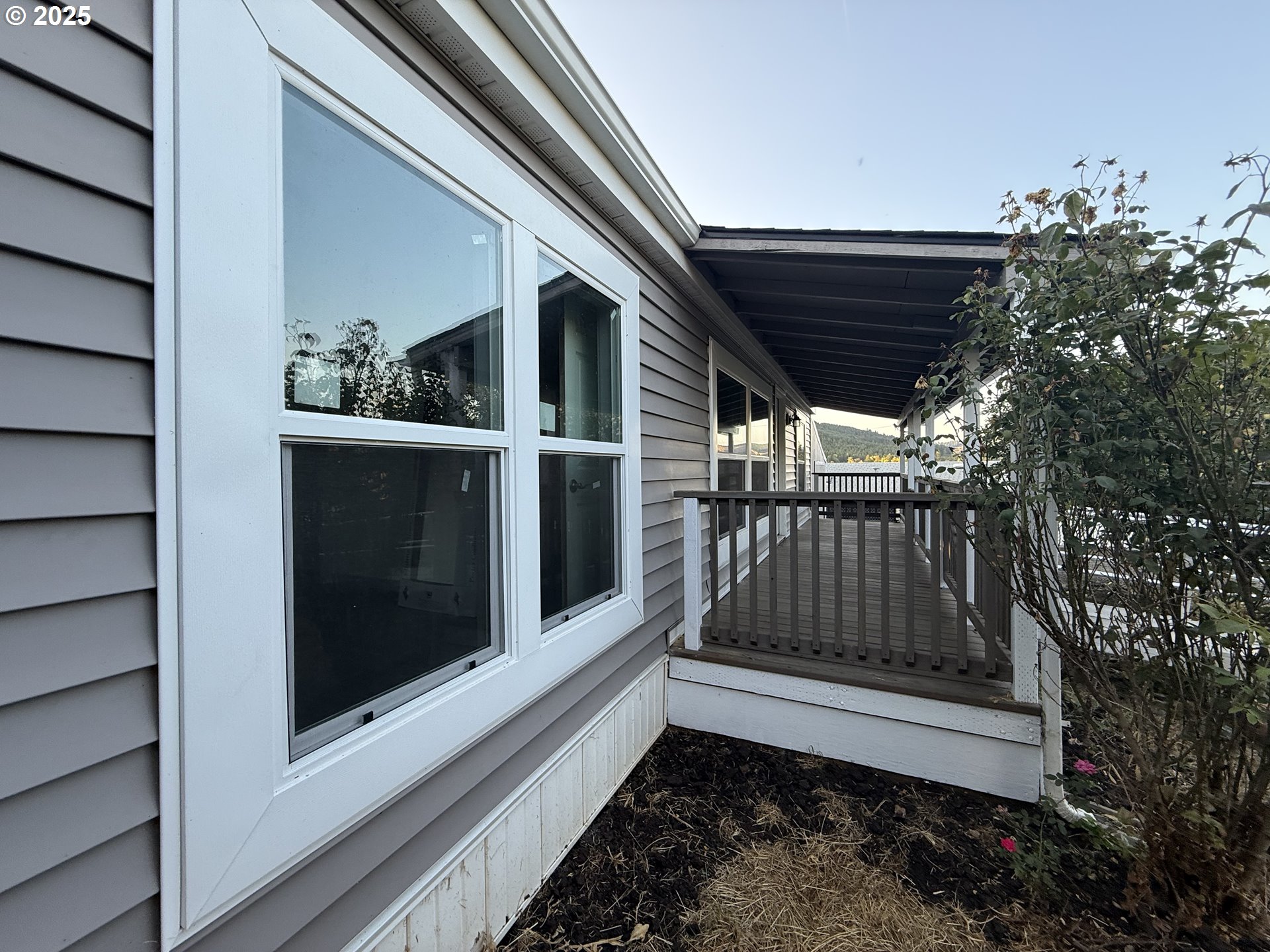373 Hayhurst Road Yoncalla, OR 97499 - Photo 26 of 33 a view of porch with wooden floor and stairs