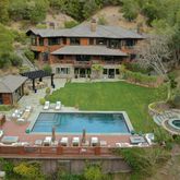 an aerial view of a house with garden space patio and outdoor seating
