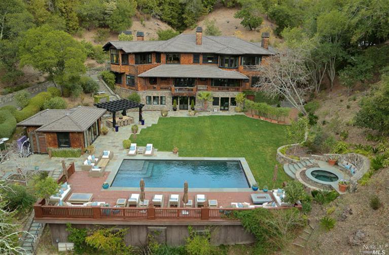 an aerial view of a house with garden space patio and outdoor seating