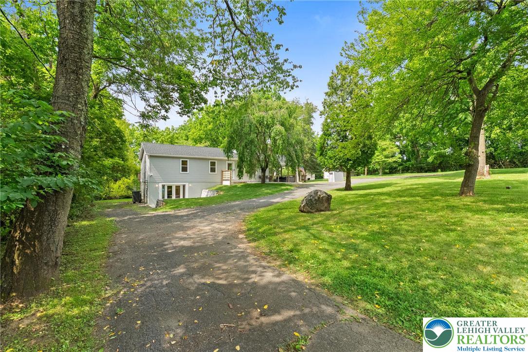 2007 Springtown Hill Road Hellertown, PA 18055 - Photo 15 of 100 a view of a house with backyard and a tree