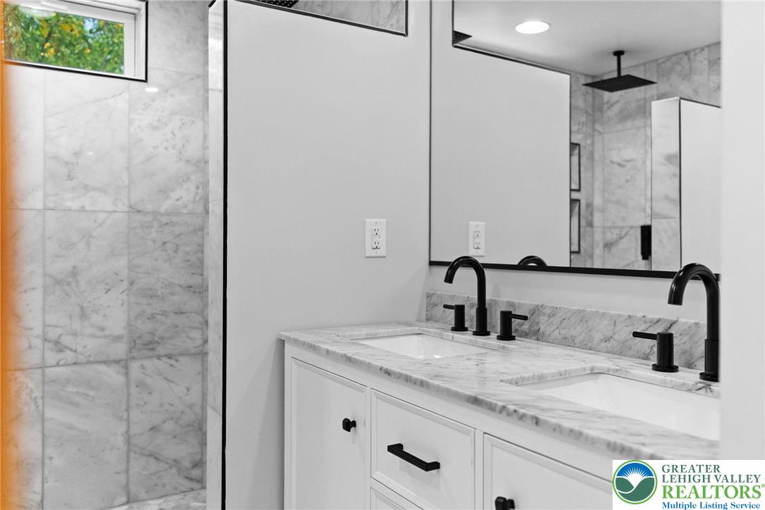 2007 Springtown Hill Road Hellertown, PA 18055 - Photo 45 of 100 a bathroom with a granite countertop sink and a mirror