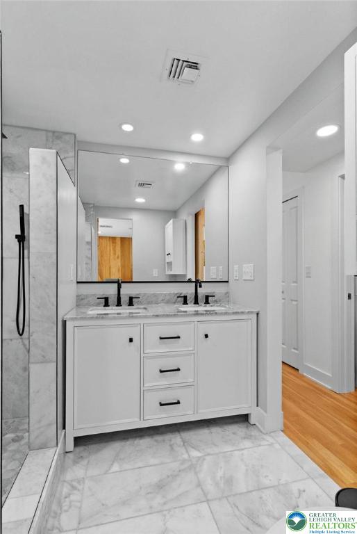 2007 Springtown Hill Road Hellertown, PA 18055 - Photo 48 of 100 a bathroom with a double vanity sink a mirror and a bathtub