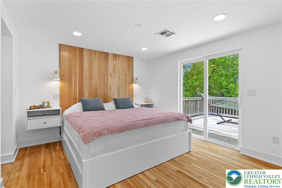 2007 Springtown Hill Road Hellertown, PA 18055 - Photo 53 of 100 a spacious bedroom with a bed and wooden floor