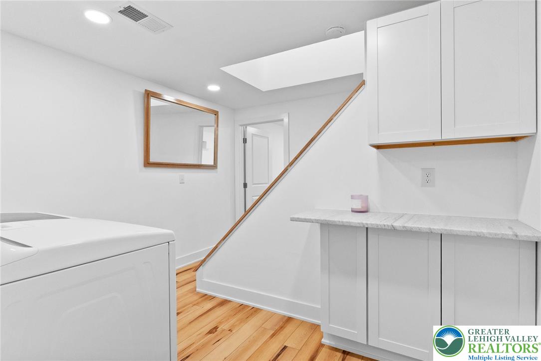2007 Springtown Hill Road Hellertown, PA 18055 - Photo 63 of 100 Lower Level Laundry Room w/ MARBLE COUNTER & Cabinets