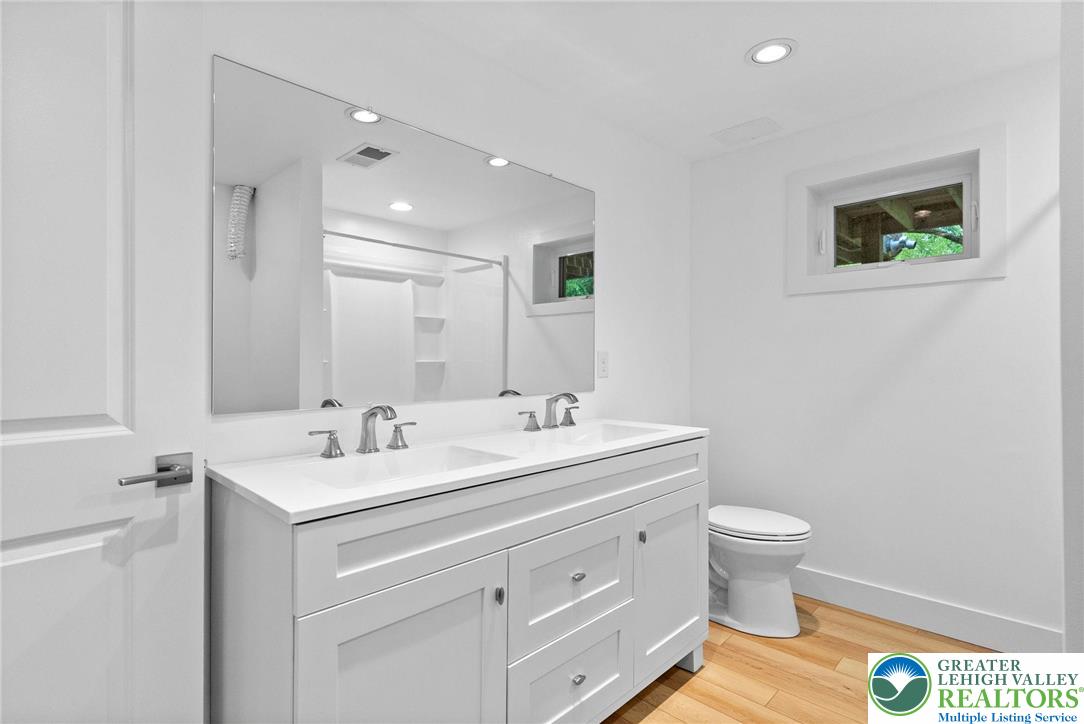 2007 Springtown Hill Road Hellertown, PA 18055 - Photo 66 of 100 a bathroom with a toilet sink and mirror