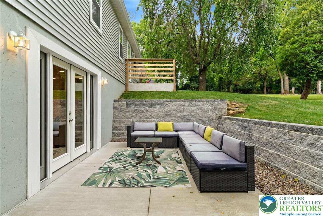 2007 Springtown Hill Road Hellertown, PA 18055 - Photo 84 of 100 Lower Level 15X12 Front Patio w/ 5FT & 3FT Stone Retaining Walls and River Rock