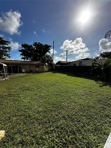 a view of a lake and a yard
