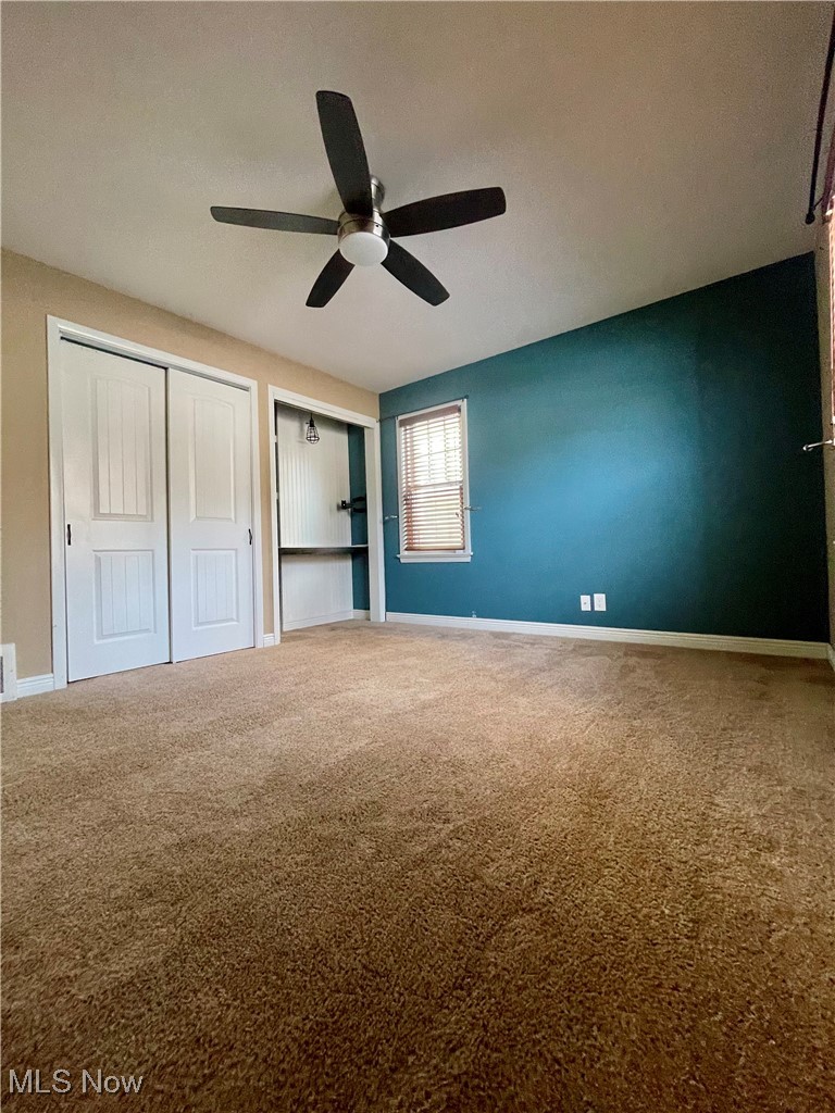 1544 Edgefield Road Lyndhurst, OH 44124 - Photo 19 of 36 Unfurnished bedroom with carpet flooring, a closet, ceiling fan, and a textured ceiling