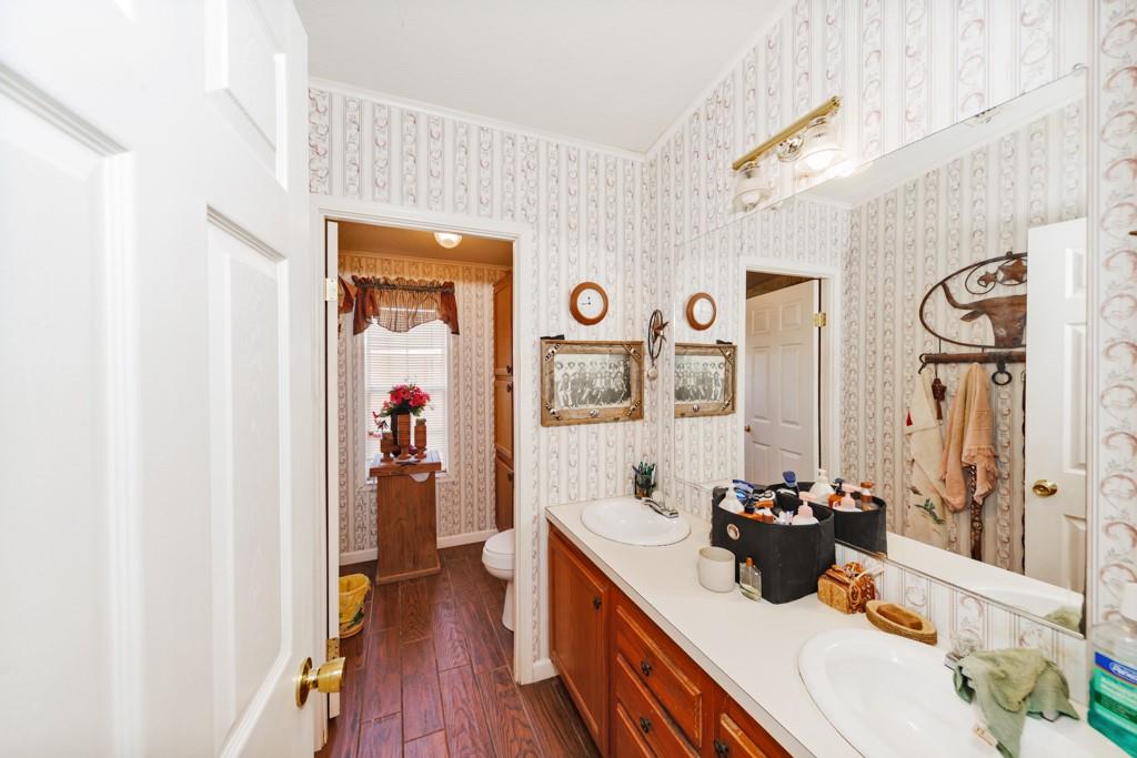 474 Hanging Tree Road Bowie, TX 76230 - Photo 12 of 27 a living room with furniture and wooden floor
