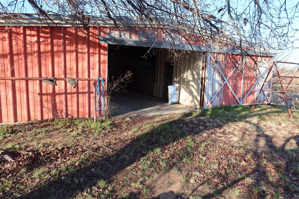 474 Hanging Tree Road Bowie, TX 76230 - Photo 25 of 27 a view of a backyard of the house