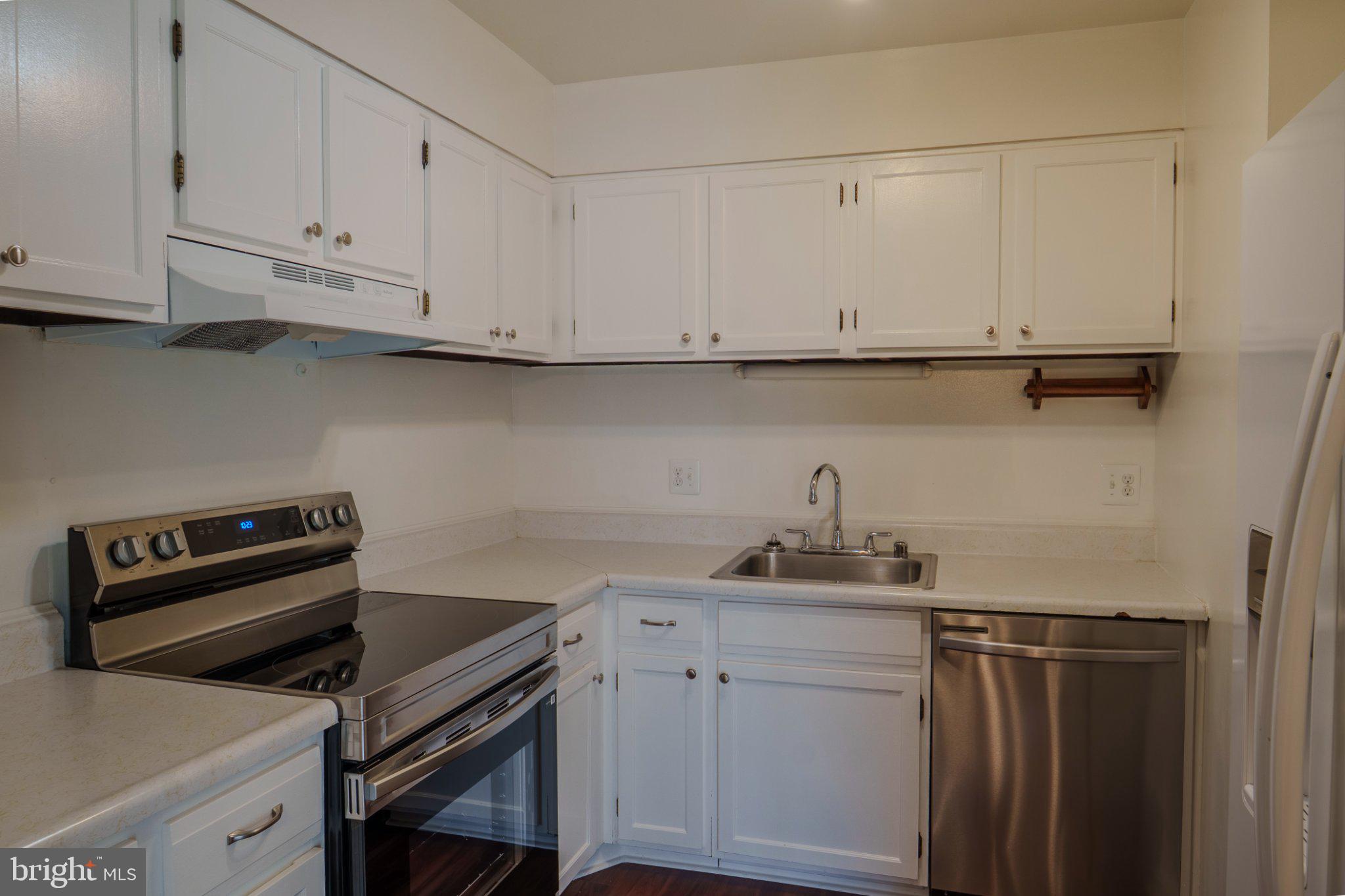 6147 Edsall Road, Unit N Alexandria, VA 22304 - Photo 9 of 28 Modern kitchen with sleek finishes.
