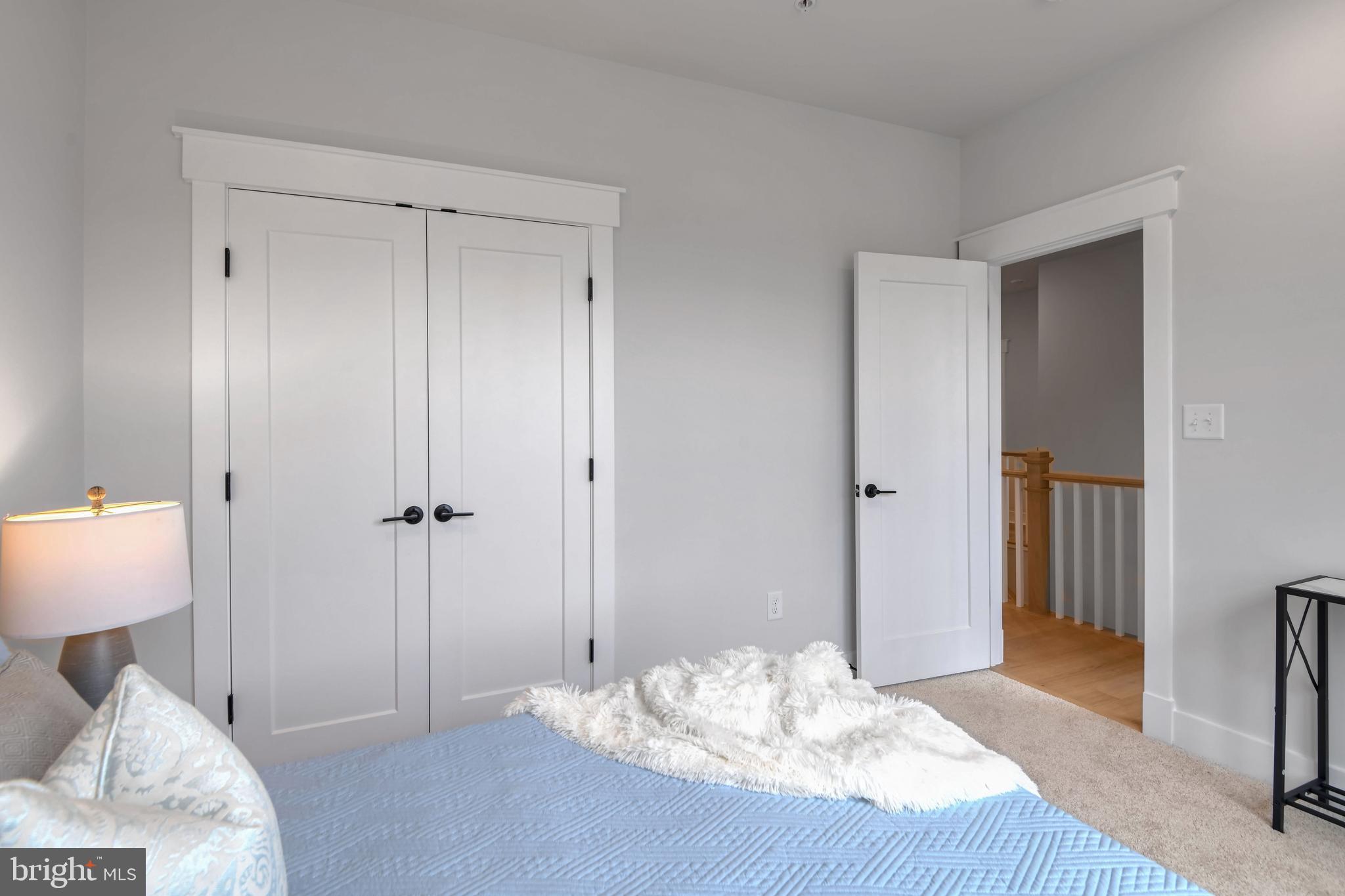 Eliana Court Laurel, MD 20708 - Photo 28 of 46 a bed room with a bed and a lamp