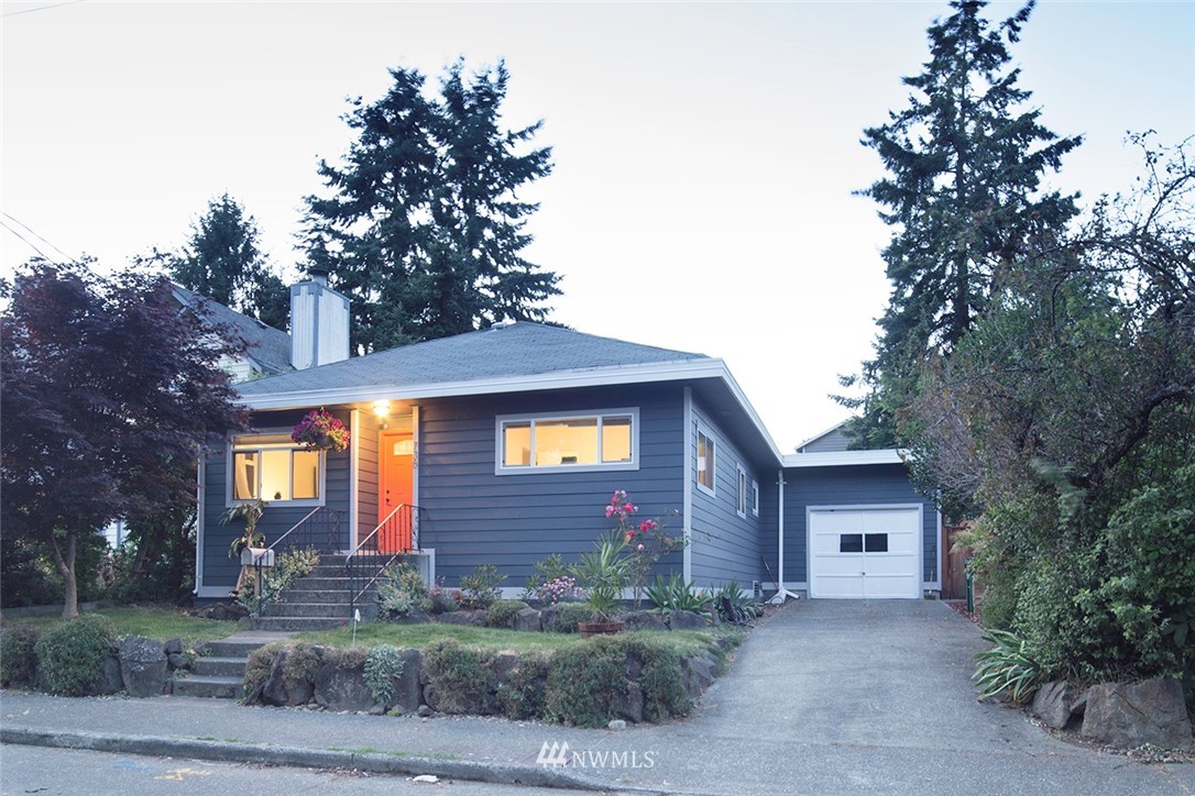 736 North 88th Street Seattle, WA 98103 - Photo 1 of 17 a front view of a house with a yard and garage