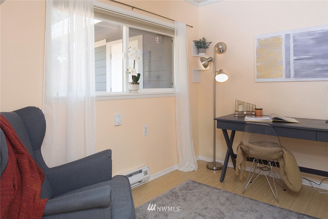 736 North 88th Street Seattle, WA 98103 - Photo 11 of 17 a living room with furniture and a window