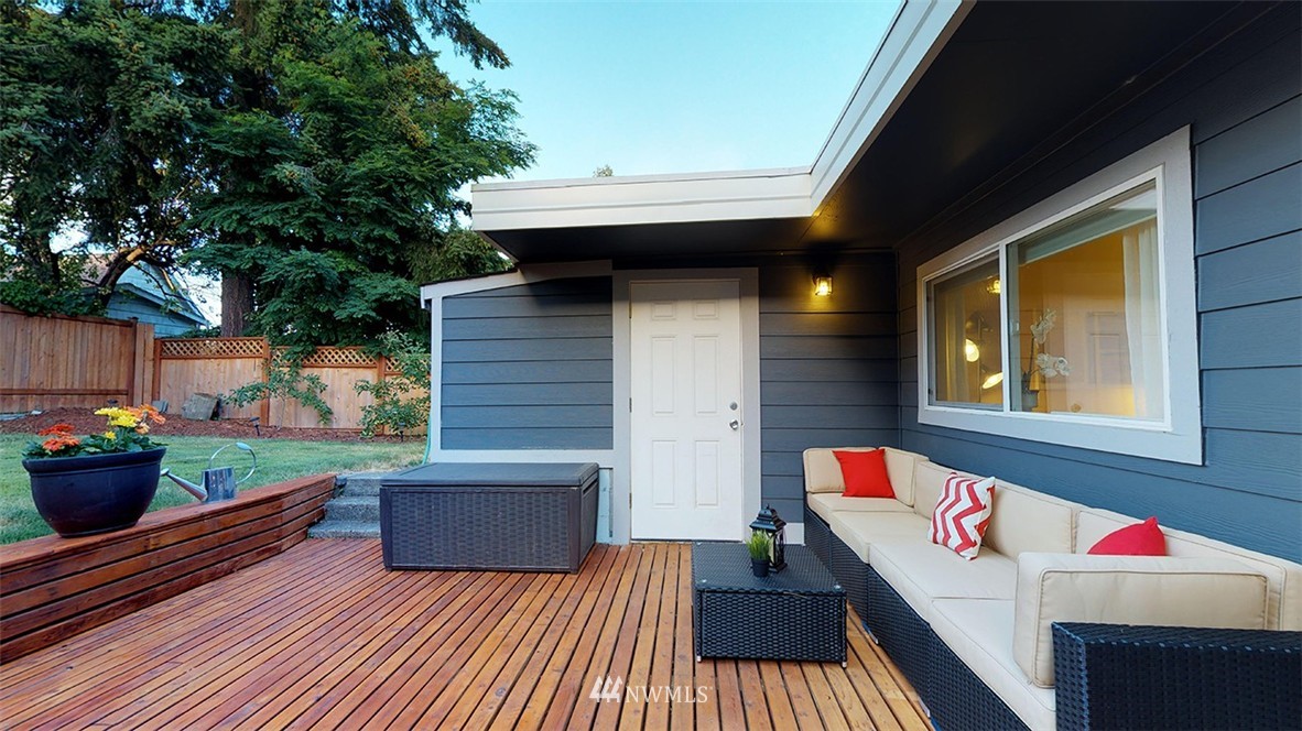 736 North 88th Street Seattle, WA 98103 - Photo 4 of 17 a backyard of a house with seating space