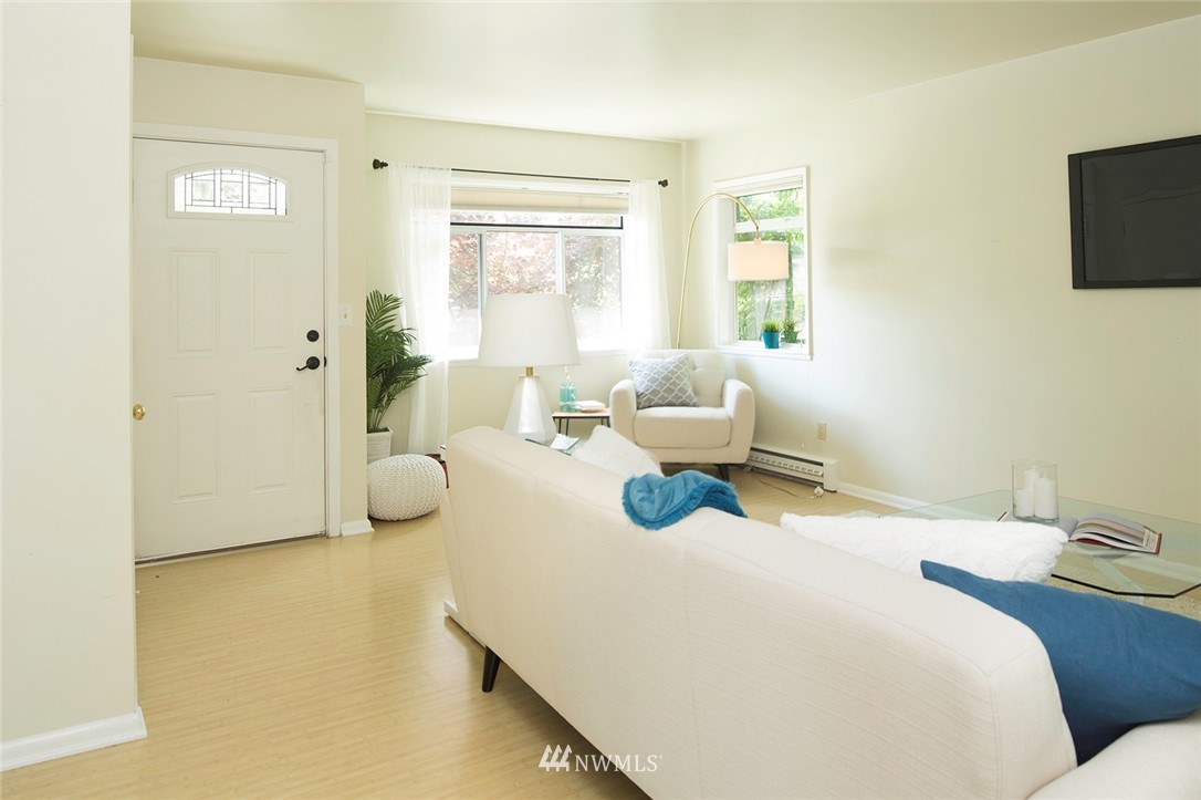 736 North 88th Street Seattle, WA 98103 - Photo 5 of 17 a bedroom with a bed and flat screen tv