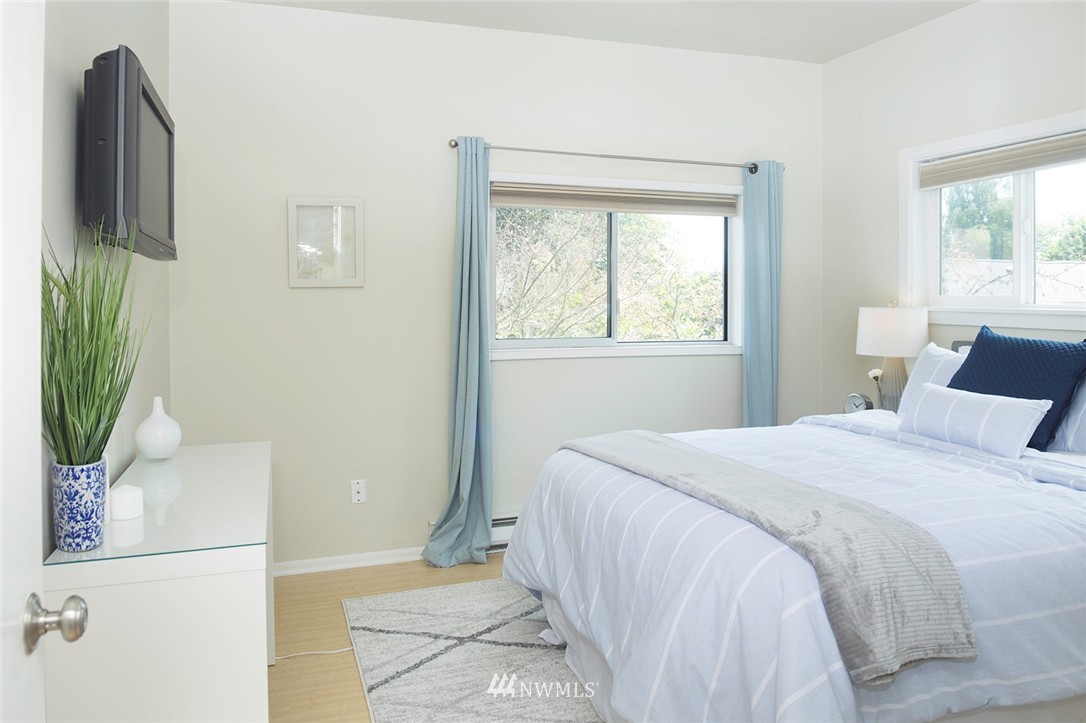 736 North 88th Street Seattle, WA 98103 - Photo 8 of 17 a bedroom with a bed and a window