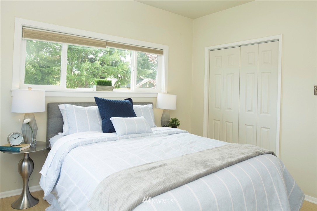 736 North 88th Street Seattle, WA 98103 - Photo 9 of 17 a bedroom with a bed and a window