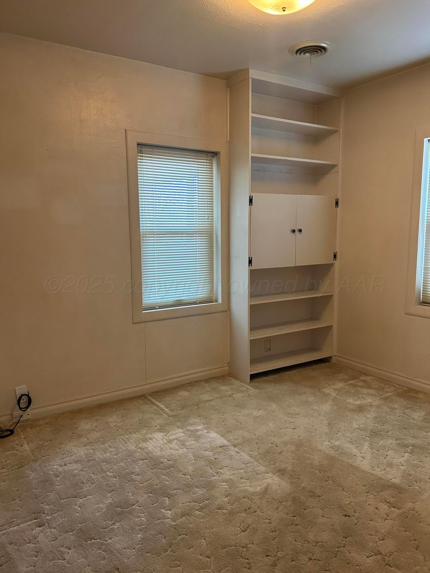 102 Willow Street Lipscomb, TX 79056 - Photo 19 of 34 a view of room and closet area