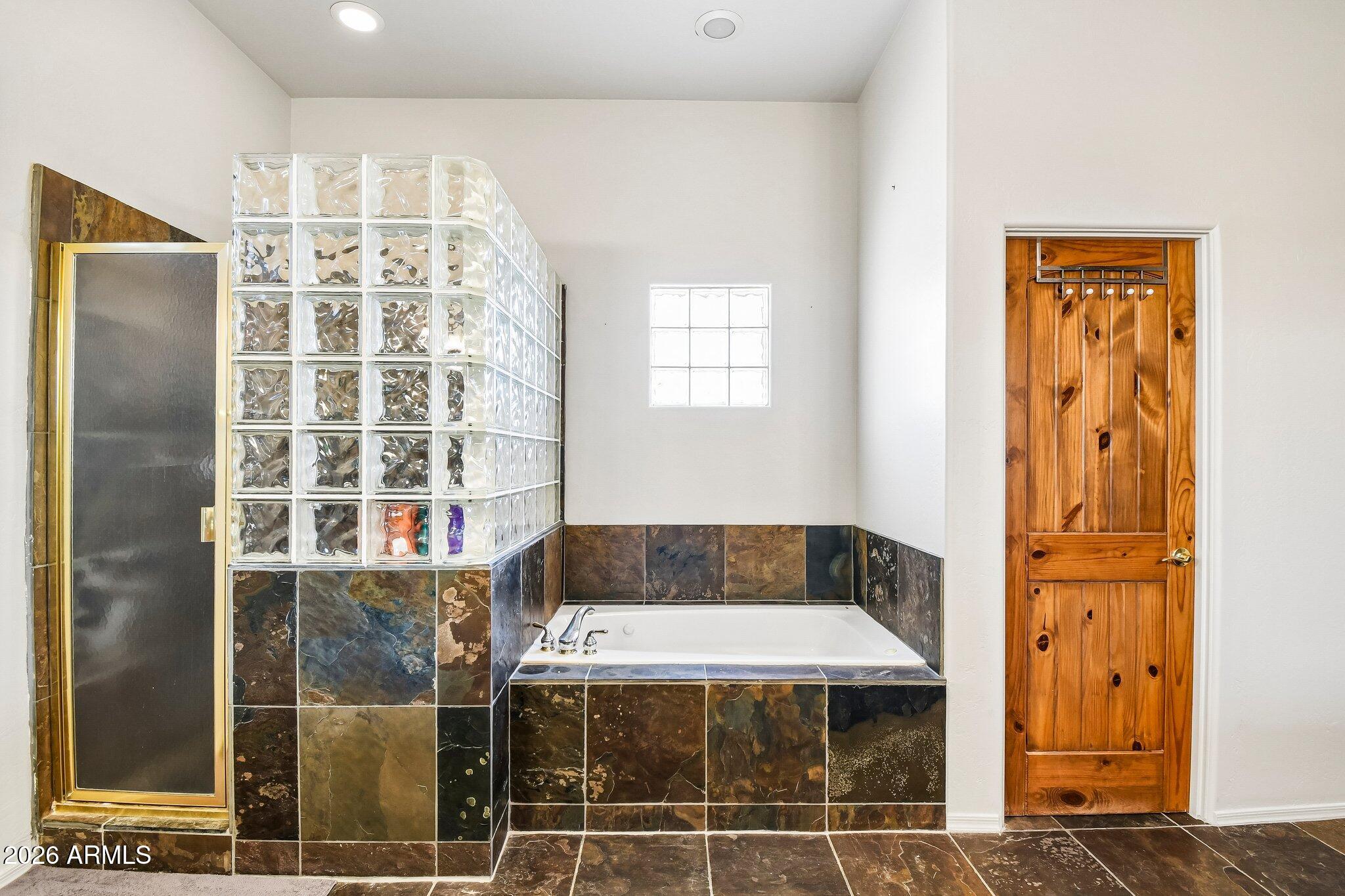1547 North Val Vista Road Apache Junction, AZ 85119 - Photo 16 of 59 a bathroom with a bathtub and shower