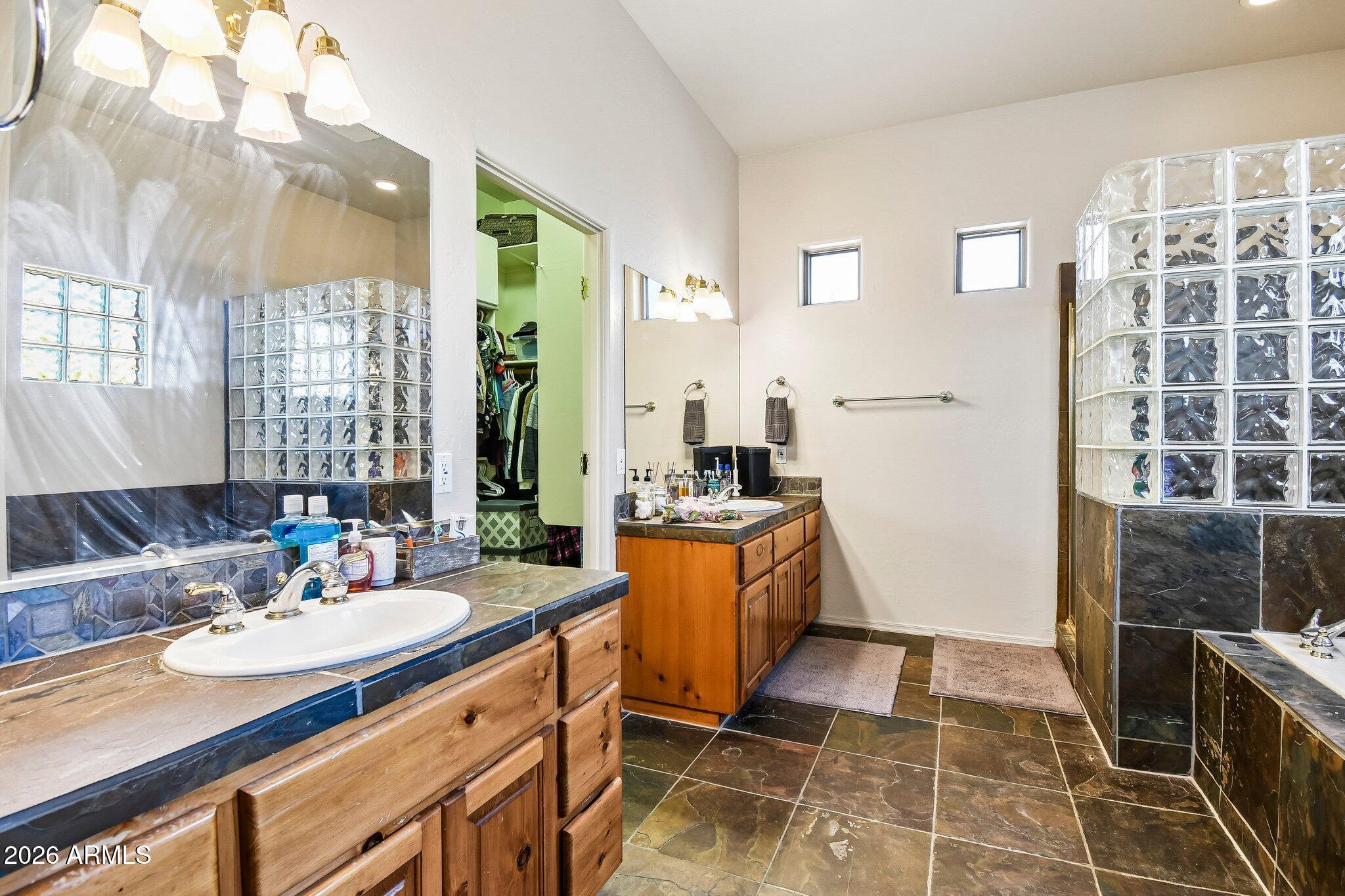 1547 North Val Vista Road Apache Junction, AZ 85119 - Photo 17 of 59 a bathroom with a tub sink and mirror