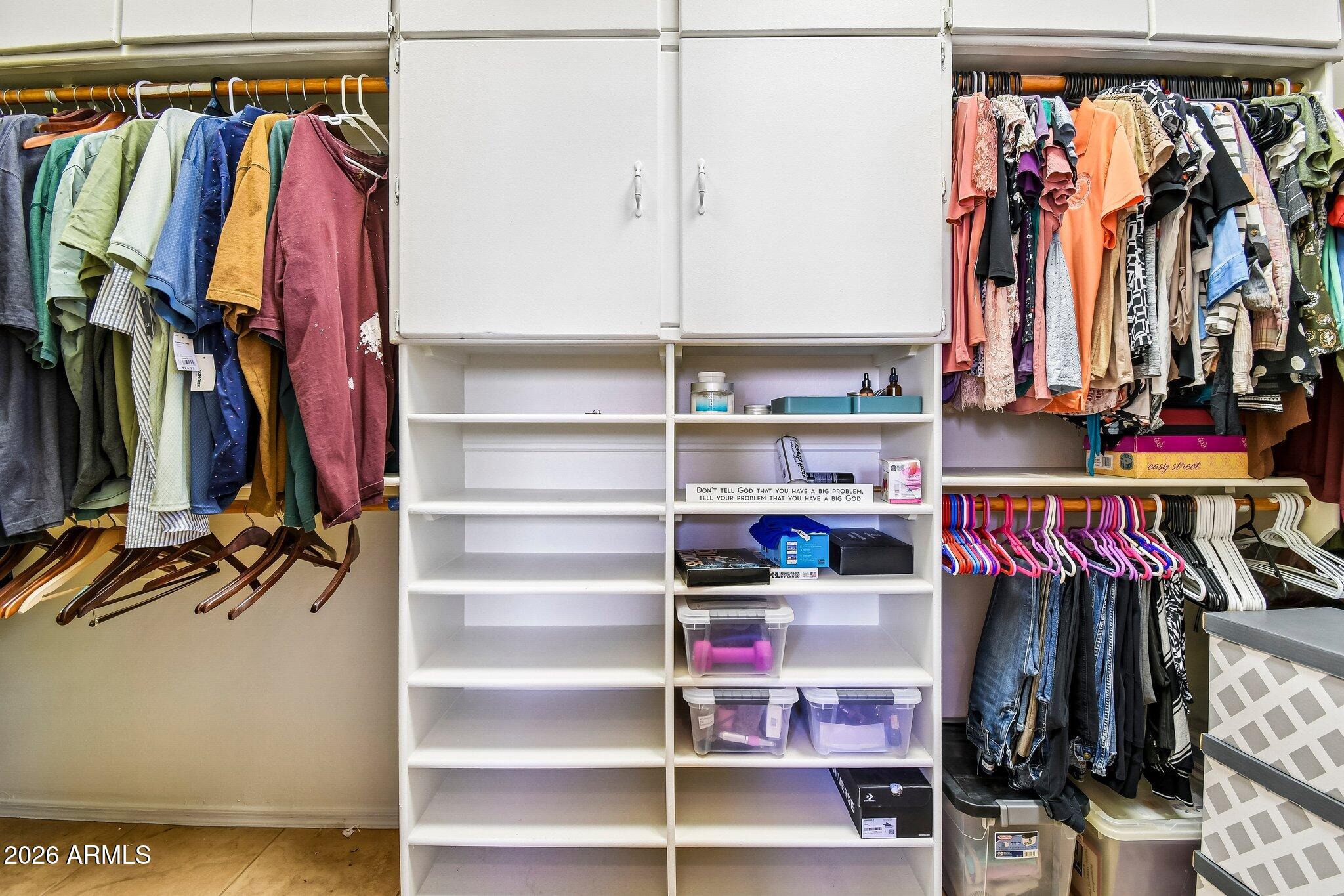 1547 North Val Vista Road Apache Junction, AZ 85119 - Photo 19 of 59 a view of walk in closet with clothes and shoes