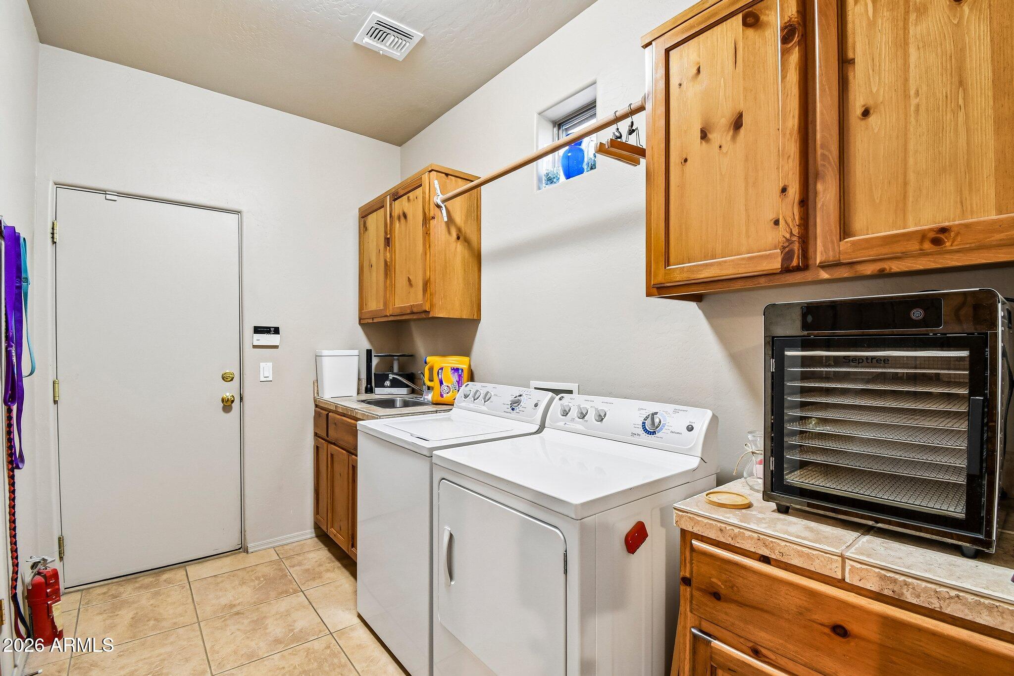 1547 North Val Vista Road Apache Junction, AZ 85119 - Photo 21 of 59 a utility room with dryer and washer