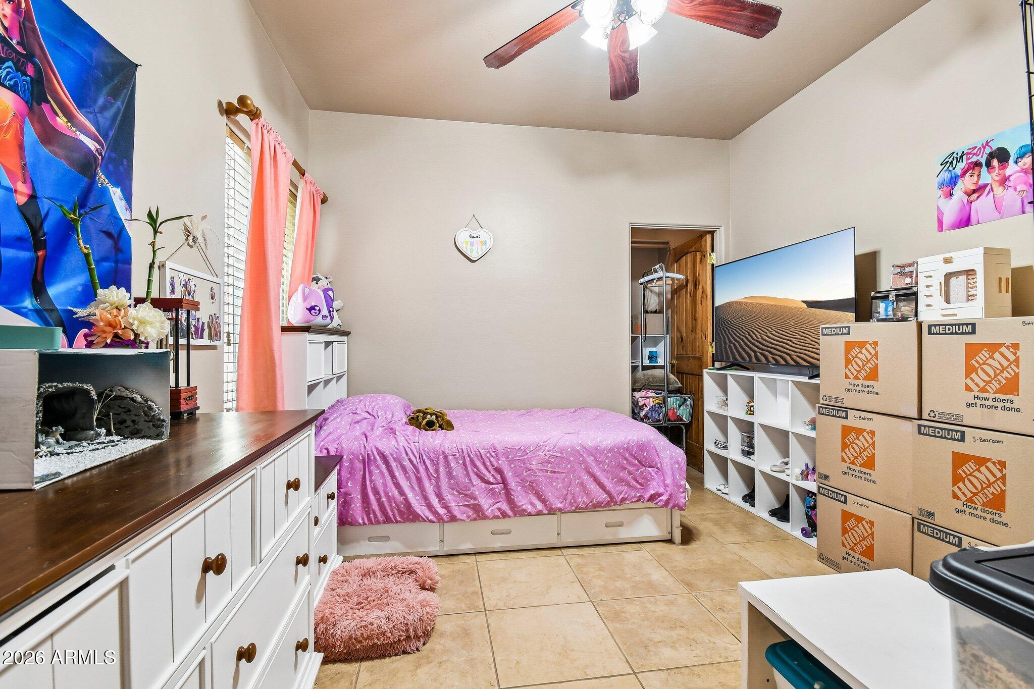 1547 North Val Vista Road Apache Junction, AZ 85119 - Photo 25 of 59 a bedroom with a bed and a flat screen tv