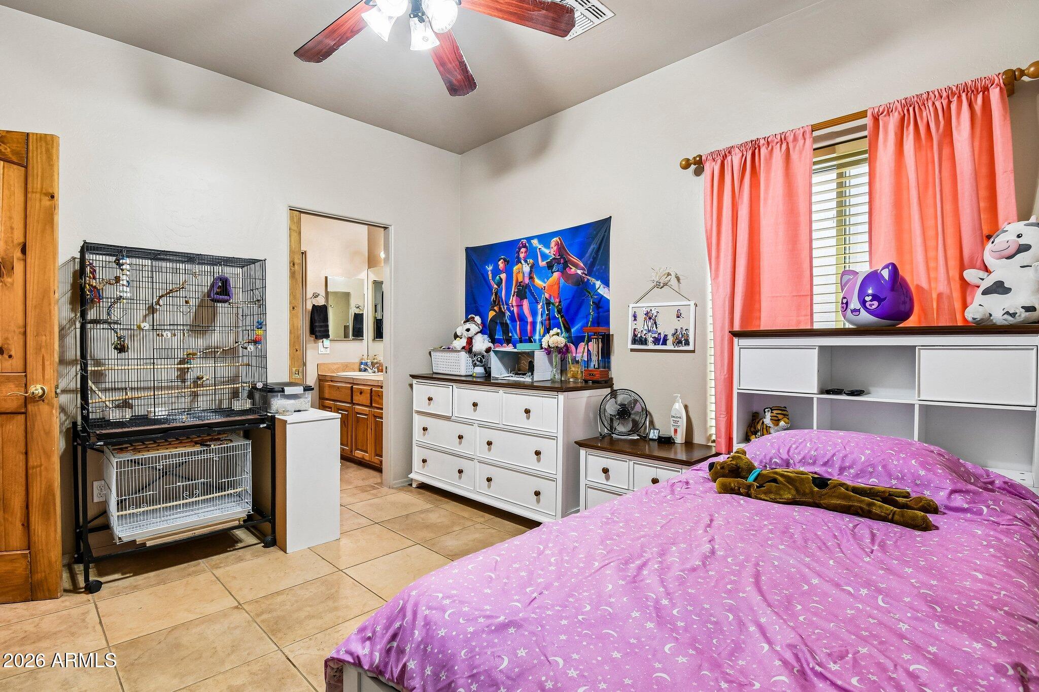 1547 North Val Vista Road Apache Junction, AZ 85119 - Photo 26 of 59 a bedroom with a bed and cabinets