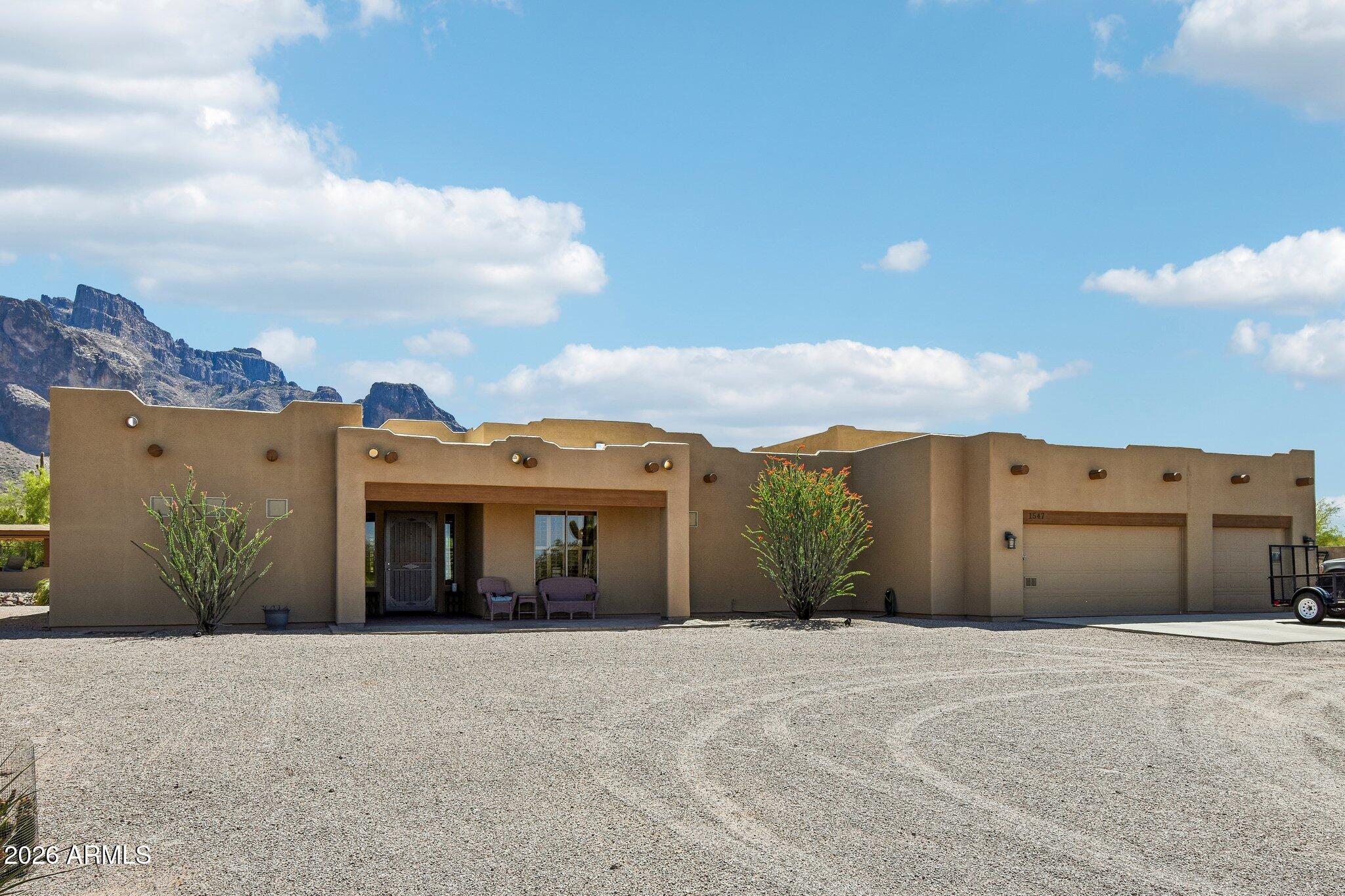1547 North Val Vista Road Apache Junction, AZ 85119 - Photo 2 of 59 front view of a house with a yard