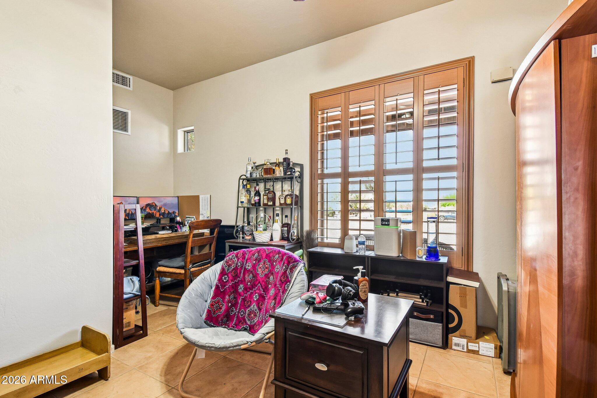1547 North Val Vista Road Apache Junction, AZ 85119 - Photo 28 of 59 a living room with furniture and a floor to ceiling window