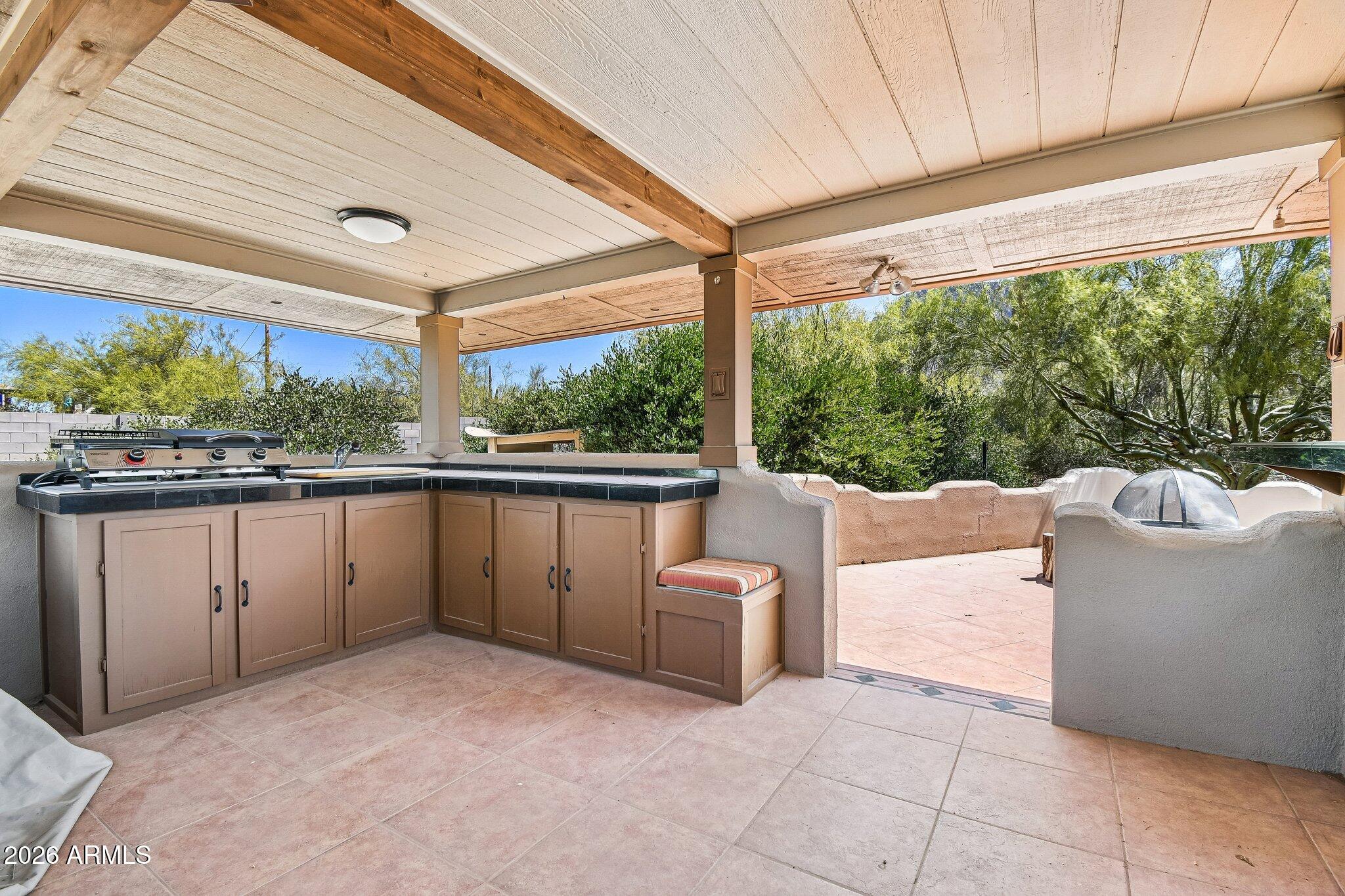 1547 North Val Vista Road Apache Junction, AZ 85119 - Photo 35 of 59 a view of a patio with a table and chairs