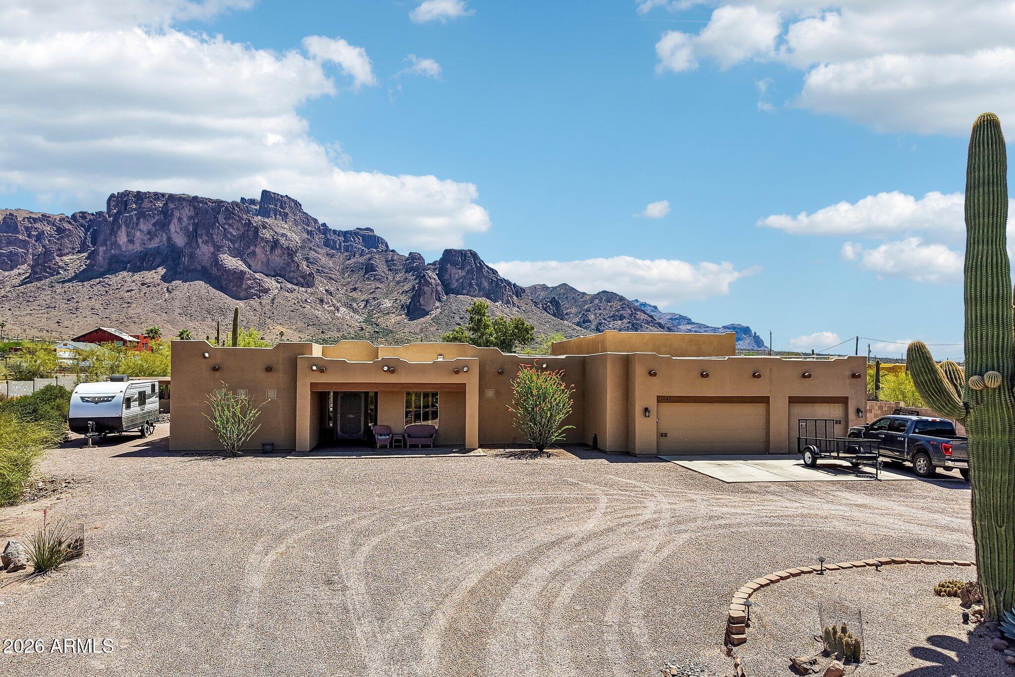 1547 North Val Vista Road Apache Junction, AZ 85119 - Photo 39 of 59 a view of a car parked in front of a building