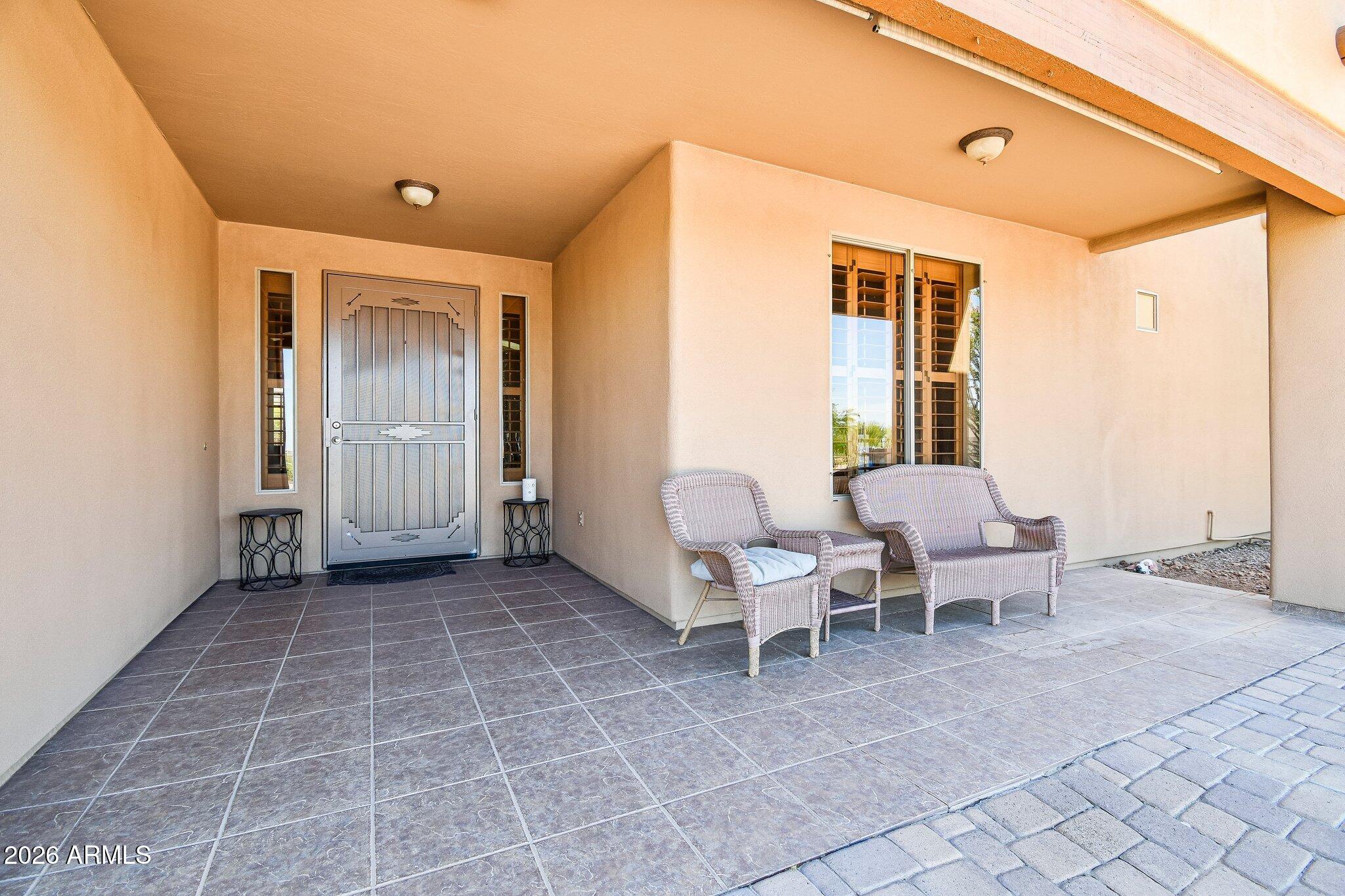 1547 North Val Vista Road Apache Junction, AZ 85119 - Photo 3 of 59 a view of a patio with table and chairs and potted plants