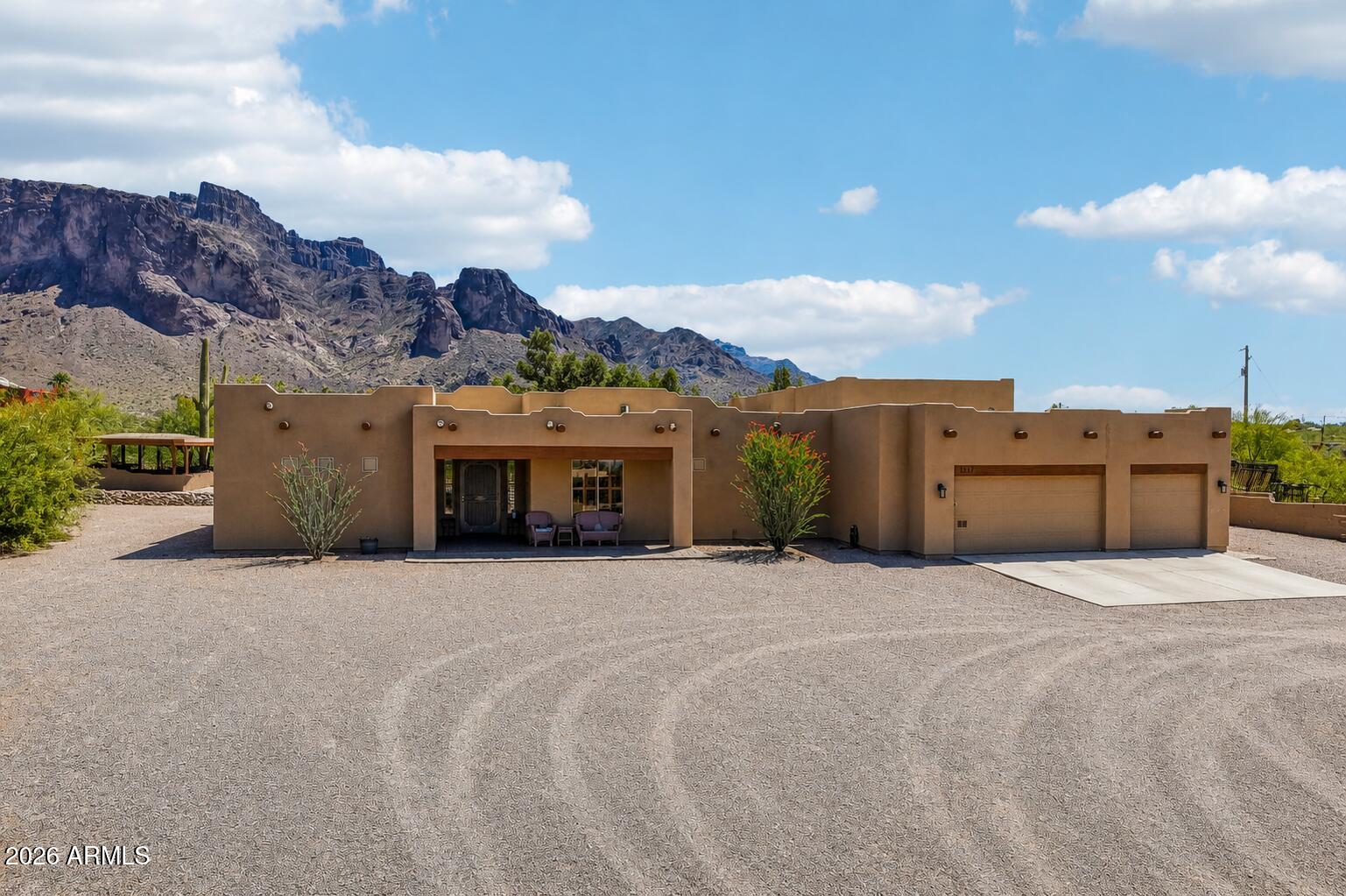 1547 North Val Vista Road Apache Junction, AZ 85119 - Photo 51 of 59 a big house with a large tree in front of it
