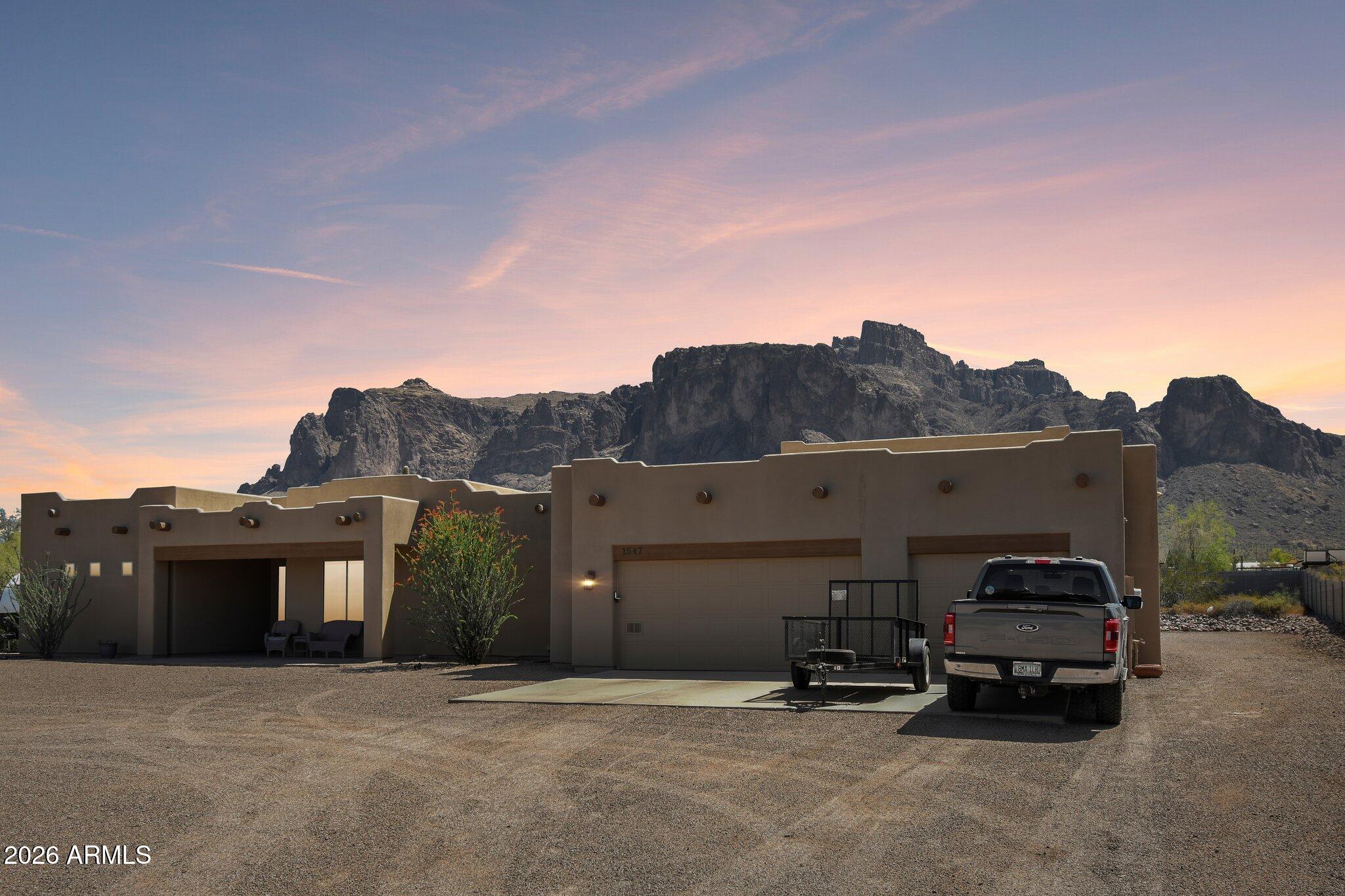 1547 North Val Vista Road Apache Junction, AZ 85119 - Photo 55 of 59 a car parked in front of a house