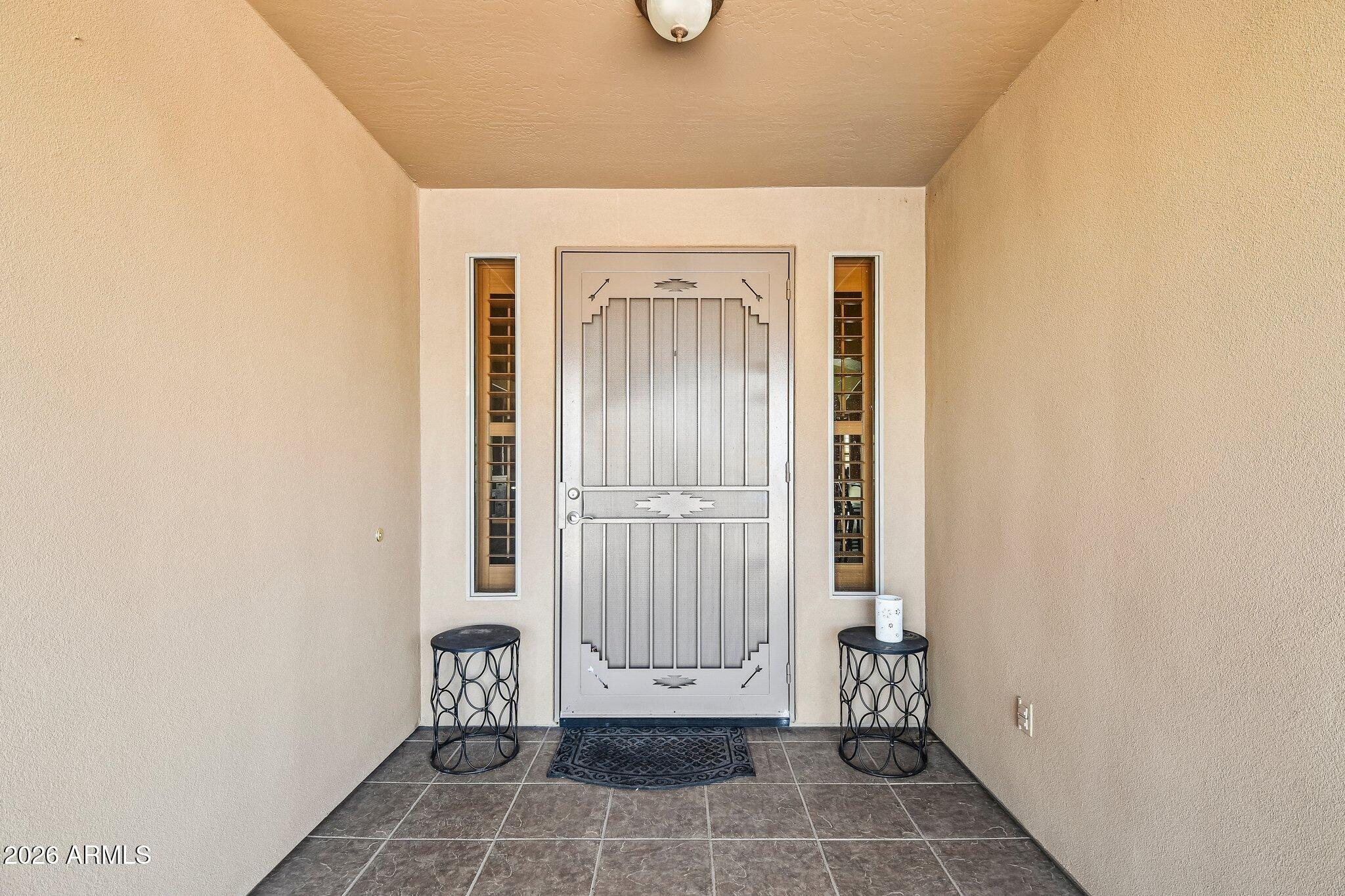 1547 North Val Vista Road Apache Junction, AZ 85119 - Photo 4 of 59 a view of an entryway with wooden door