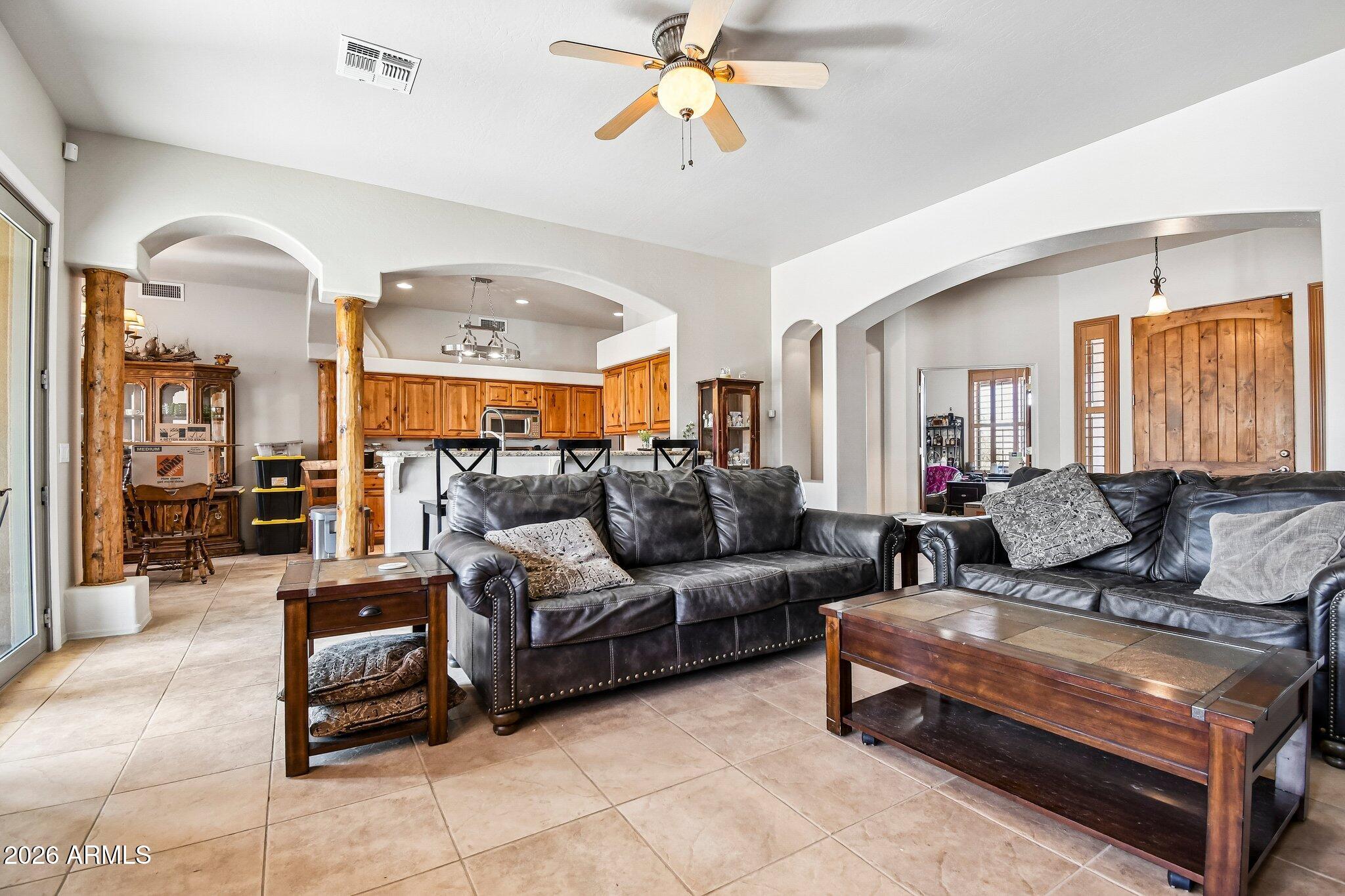 1547 North Val Vista Road Apache Junction, AZ 85119 - Photo 6 of 59 a living room with furniture and a chandelier