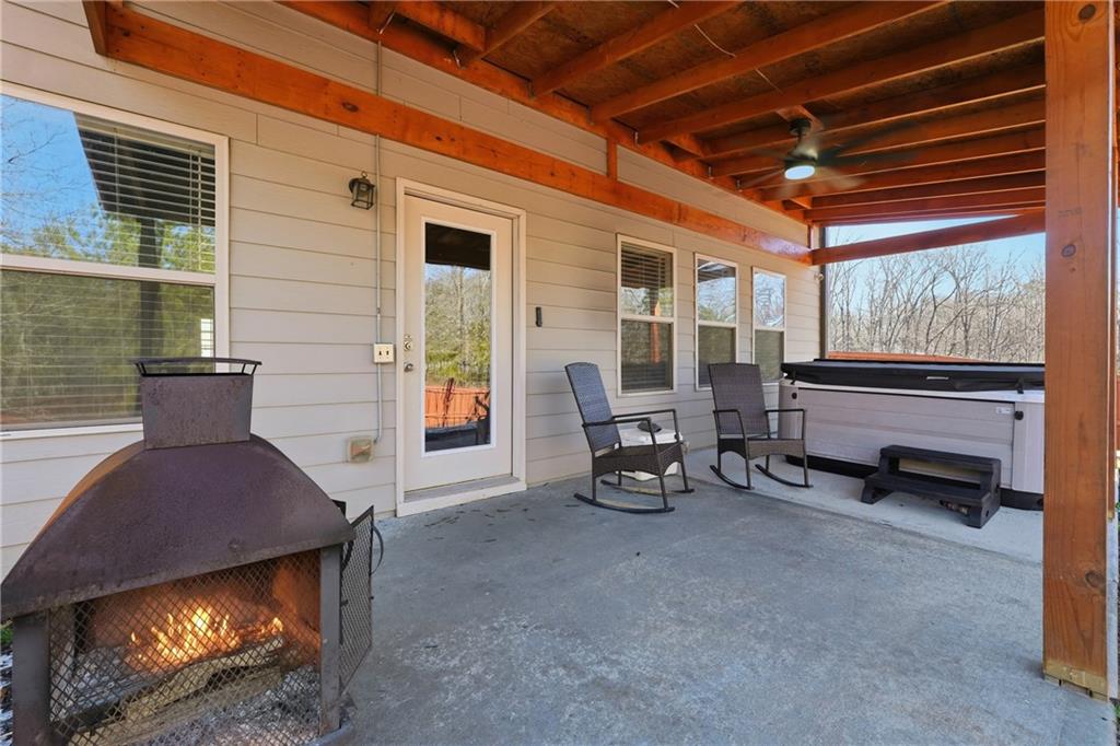 847 Wellford Avenue Jefferson, GA 30549 - Photo 13 of 33 a living room with furniture a fireplace and a table