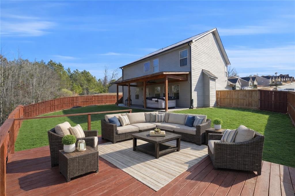 847 Wellford Avenue Jefferson, GA 30549 - Photo 14 of 33 a view of a patio with couches chairs and a yard