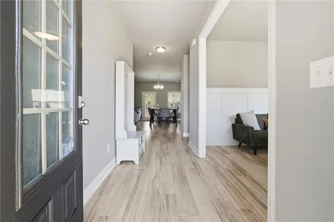 a view of a living room and a wooden floor