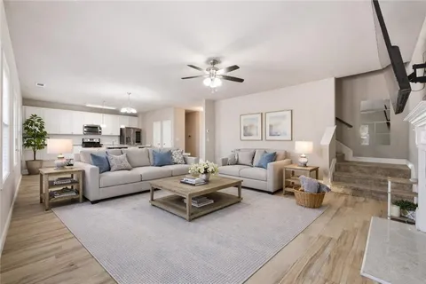 a living room with furniture and a chandelier