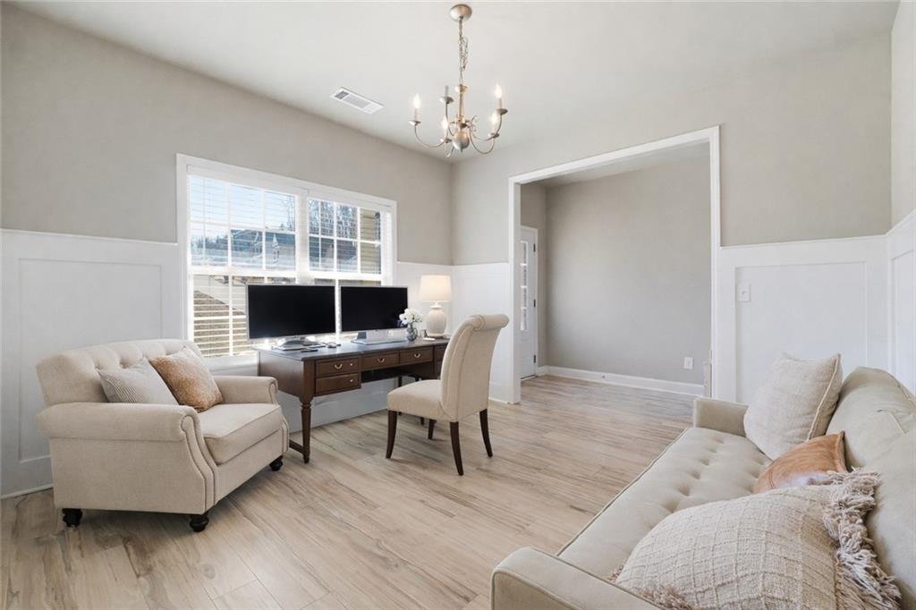 847 Wellford Avenue Jefferson, GA 30549 - Photo 21 of 33 a living room with furniture and a flat screen tv