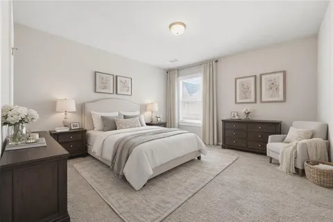 a spacious bedroom with a bed and a couch