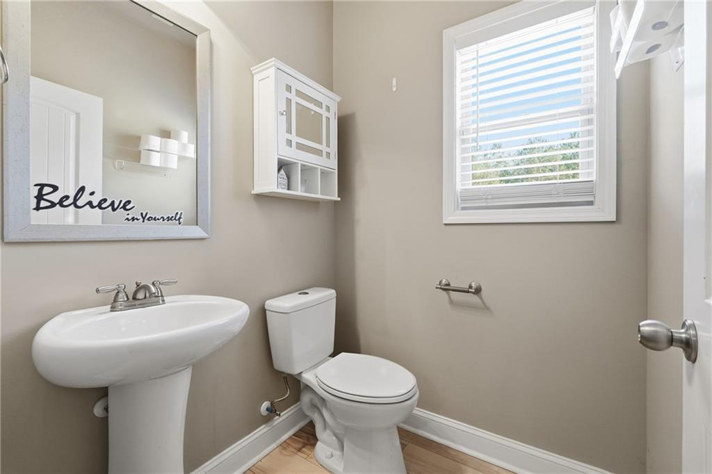 847 Wellford Avenue Jefferson, GA 30549 - Photo 27 of 33 a bathroom with a toilet sink and mirror