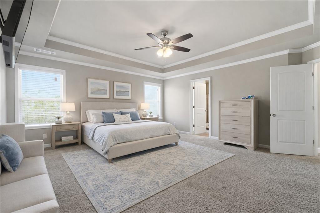 847 Wellford Avenue Jefferson, GA 30549 - Photo 6 of 33 a spacious bedroom with a large bed and a couch